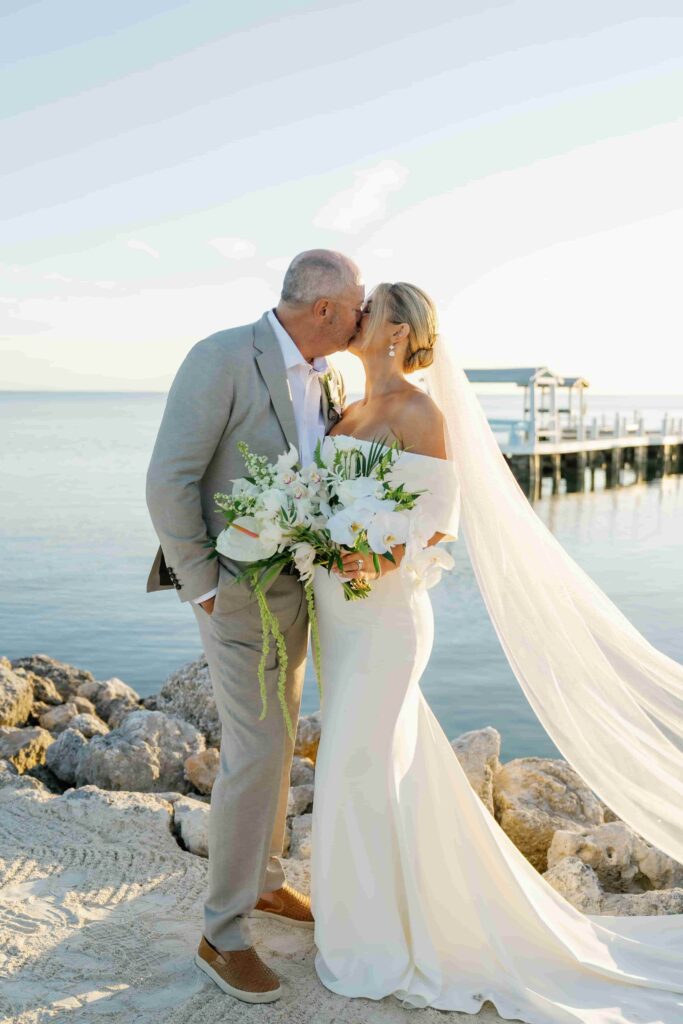Alissa and rob kissing after wedding